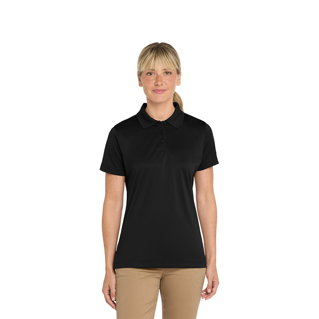 Woman wearing a black polo shirt and beige pants on a white background