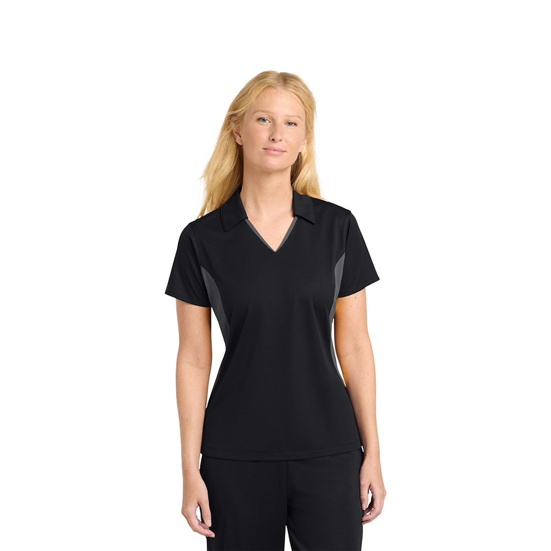 Woman wearing a black and gray polo shirt on a white background