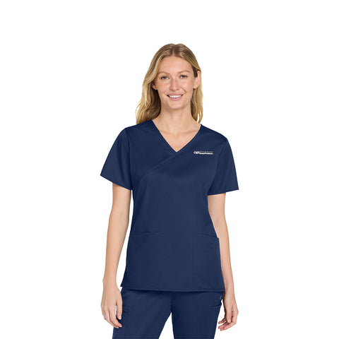 Woman wearing a navy blue scrub set on a white background