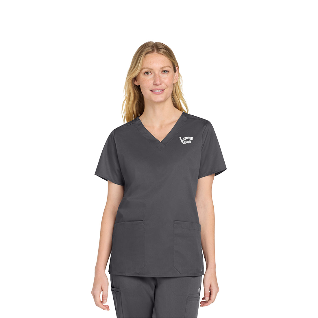 Woman wearing a gray scrub set on a white background